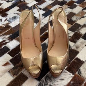 Louboutin gold platform sandals!
